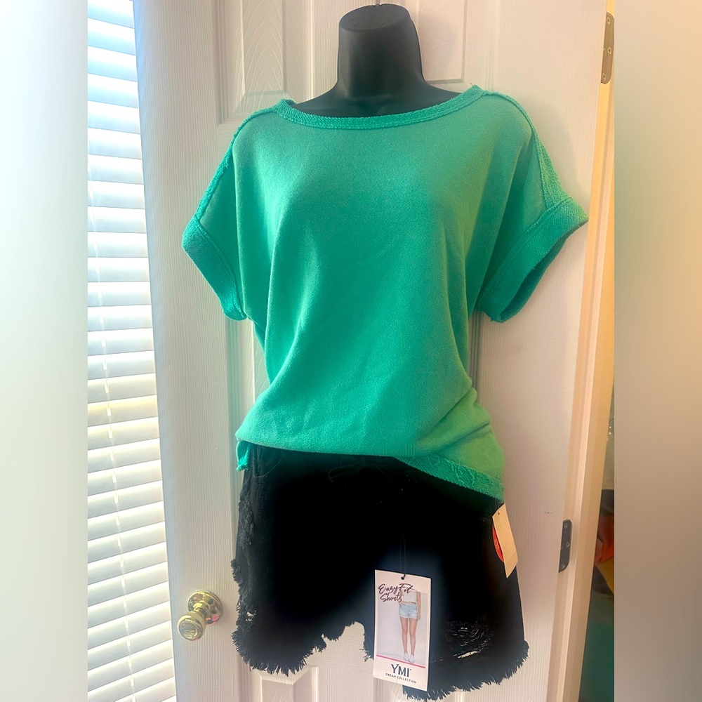 Fun green top by First Love. Size small